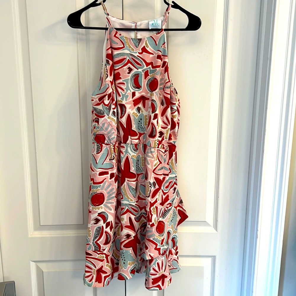 NWOT, cute pink floral dress w ruffling at the bottom! Purchased from a boutique